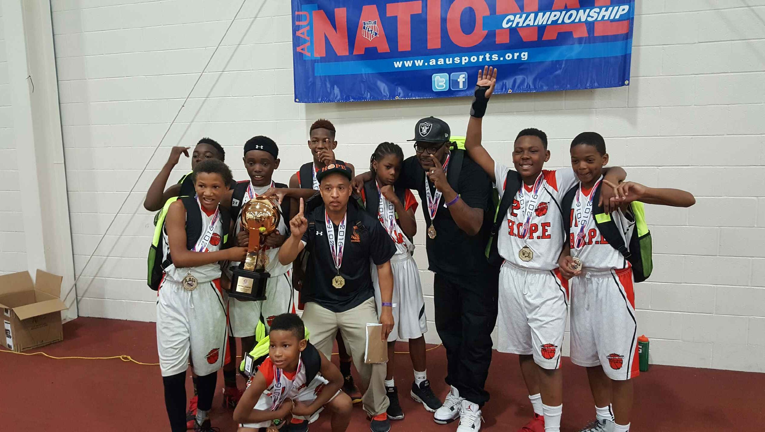 AAU basketball team returns a champion