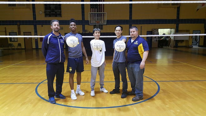Belleville boys volleyball: (from left) coach John Spina, Alicides Dos Reis, who had 500 career kills, Fidel Barraza (500 digs), Michael Feneque (1,000 assists) and assistant coach Ryan Sheridan.