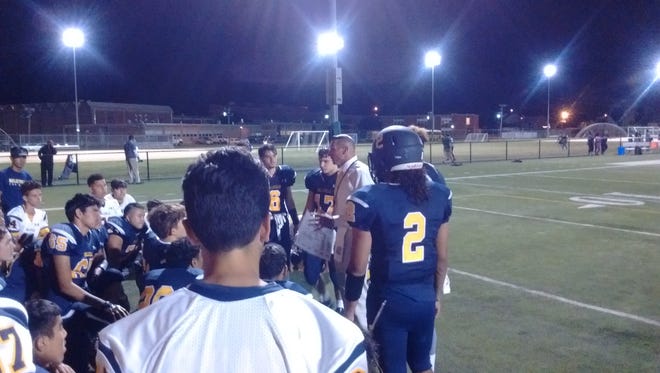 Belleville coach Mario Cuniglio addressing his team after a 28-13 loss to Newark West Side.