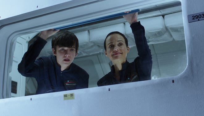 Asa Butterfield and Carla Gugino in a scene from "The Space Between Us."