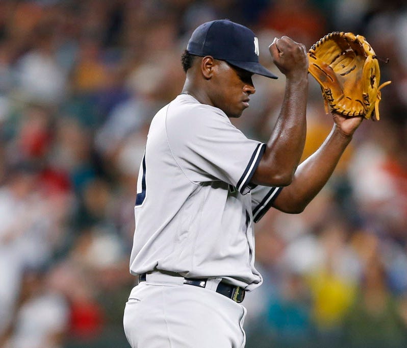 New York Yankees starting pitcher Luis Severino (40) reacts after getting the final out of the seventh inning against the Seattle Mariners at Safeco Field.