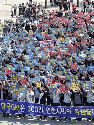Workers from subcontractors of GM Korea and citizens call for the early normalization of the ailing carmaker's operations during a rally in Incheon, west of Seoul, South Korea,  April 17, 2018.