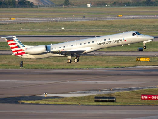An American Eagle branded Embraer 145 jet takes off