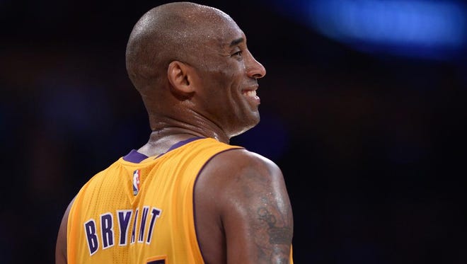 Lakers forward Kobe Bryant smiles during the third quarter against the Utah Jazz at Staples Center on Wednesday night. Bryant was playing in the final game of his NBA career.