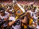 Iowa defensive lineman Nathan Bazata carries the Heroes Game trophy after Iowa beat Nebraska, 56-14, on Friday, Nov. 24, 2017, at Memorial Stadium in Lincoln, Neb.