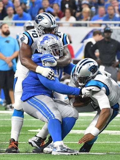 Panthers' Trai Turner can't stop Lions' Akeem Spence