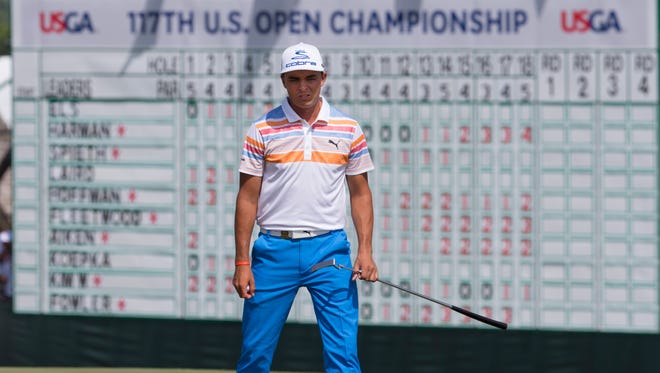 Rickie Fowler waits to putt on the 18th green during the first round of the U.S. Open golf tournament at Erin Hills.