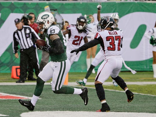 New York Jets tight end Eric Tomlinson (83) runs past Atlanta Falcons Ricardo Allen (37) for a touchdown during the first half of an NFL football game Sunday, Oct. 29, 2017, in East Rutherford, N.J. (AP Photo/Seth Wenig)
