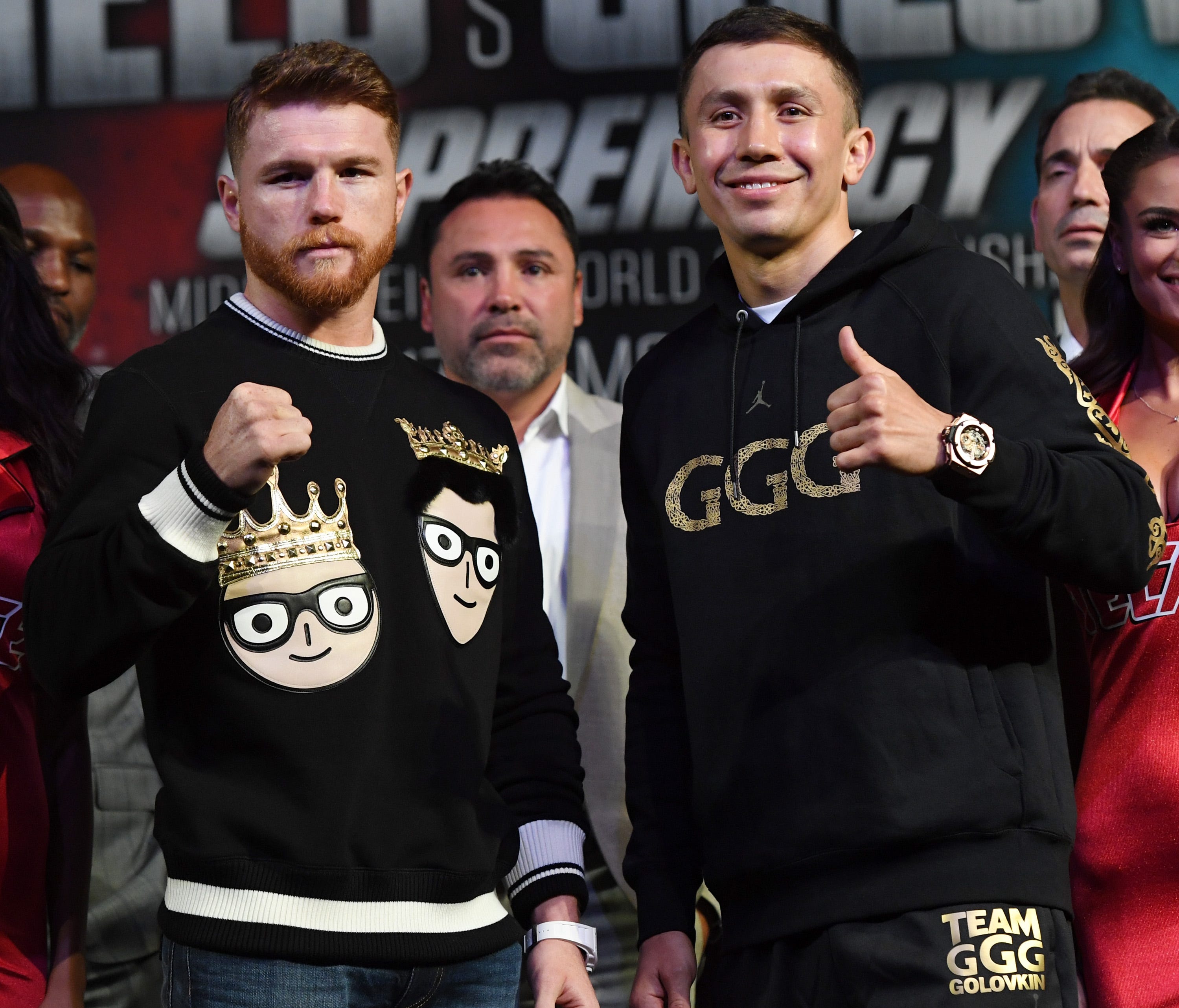 Golden Boy Promotions Chairman and CEO Oscar De La Hoya (center) looks on as Canelo Alvarez (left) and WBC, WBA and IBF middleweight champion Gennady Golovkin pose during a news conference at MGM Grand Hotel & Casino on Sept. 12, 2017 in Las Vegas.