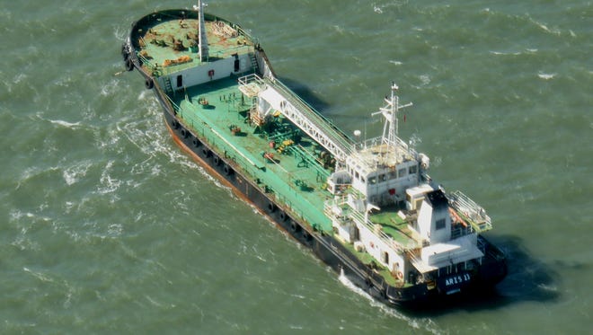 In this photo taken Monday, Oct. 27, 2014, the Aris 13 oil tanker is seen from a helicopter in the harbor of Gladstone, Australia. Pirates have hijacked the Aris 13 oil tanker off the coast of Somalia, officials and piracy experts said Tuesday, March 14, 2017, the first such seizure of a large commercial vessel on the crucial global trade route since 2012.