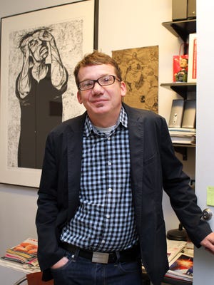 Aaron Cowan stands at the door of his office. Cowan, director of DAAP Galleries at the University of Cincinnati, was among those who protested in favor of the Robert Mapplethorpe exhibit at the Contemporary Art Center.