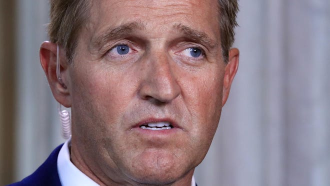 Sen. Jeff Flake, R-Ariz., speaks during a television interview Capitol Hill in Washington, Tuesday, Oct. 24, 2017. Sen. Flake, an Arizona Republican, announced he would not run for re-election in 2018, condemning in a speech aimed at President Donald Trump the "flagrant disregard of truth and decency" that is undermining American democracy. (AP Photo/Manuel Balce Ceneta)
