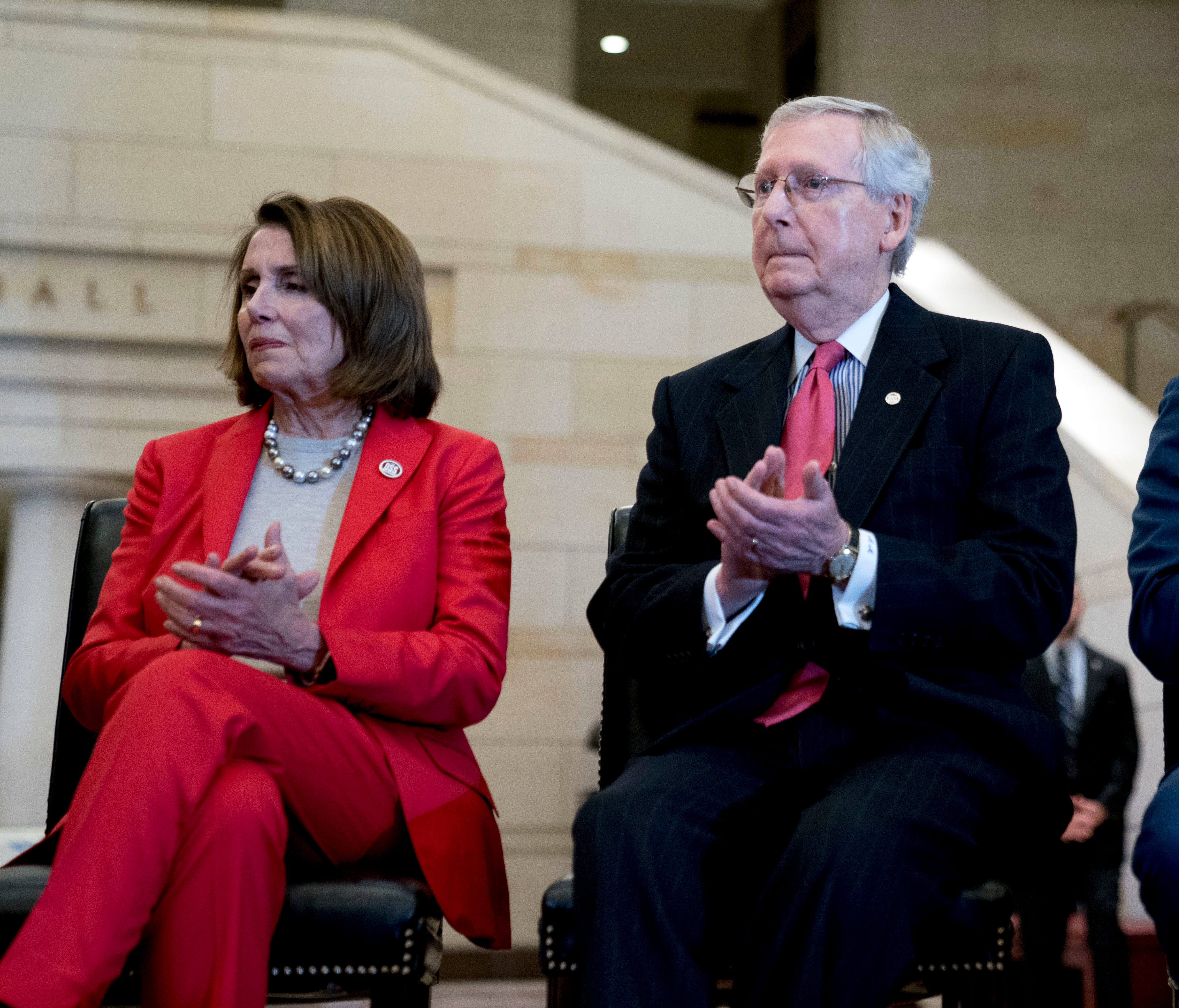 From left, House Minority Leader Nancy Pelosi of Calif., Senate Majority Leader Mitch McConnell of Ky., and House Speaker Paul Ryan of Wis., appear together on Capitol Hill in Washington, March 21, 2018.
