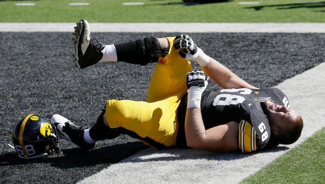 Iowa offensive linesman Brandon Scherff reacts after getting injured during the first half against Ball State on Saturday, Sept. 6.