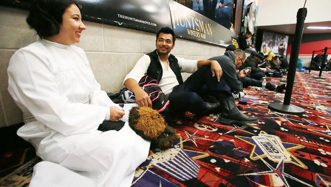 Sandra Hardy is dressed as Princess Leia and Jonathan Lucero is dressed as Han Solo as they wait for the first showing of "Star Wars: The Force Awakens" on Thursday at Premiere Cinema + Imax at Bassett Place. See more photos on Page 6B and at elpasotimes.com.