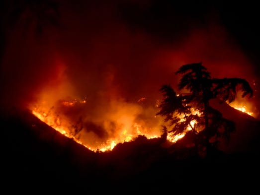 The Thomas Fire burns in the hills near Steckel Park