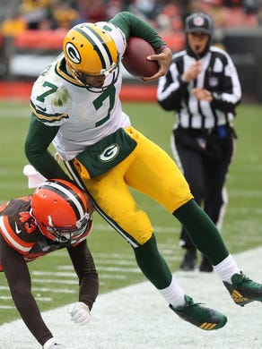 Green Bay Packers quarterback Brett Hundley (7) gets launched out of bounds by Cleveland Browns defensive back Kai Nacua (43) on a scramble Sunday, Dec. 10, 2017 at FirstEnergy Stadium in Cleveland.