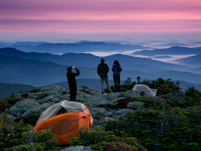 Robert Weiss of Tewksbury, Massachusetts, left, photographs