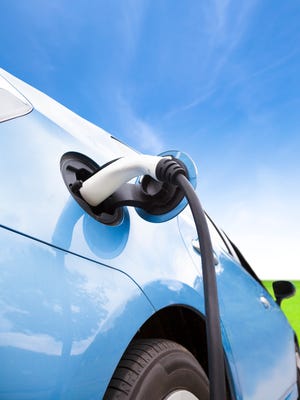 Photo illustration of an electric car charging