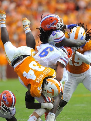 Linebacker Jalen Reeves-Maybin makes a tackle in a 10-9 2014 loss to Florida.