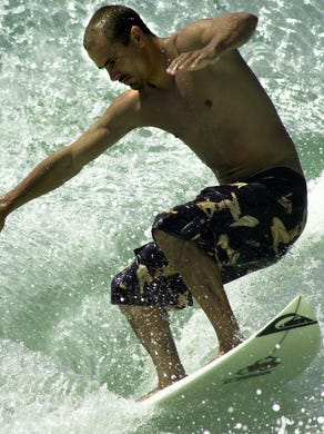 Kelly Slater rides the waves at Sebastian Inlet in 1999.