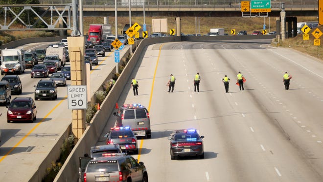 Milwaukee County Sheriff's deputies investigate a reported shooting on northbound Interstate 43 north of the Marquette Interchange. All northbound lanes are closed.