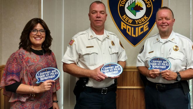 Shoshana Bernstein, Ramapo Police Capt. Martin Reilly and Chief Brad Weidel display the magnets being distributed in the "Appreciation Matters" campaign.