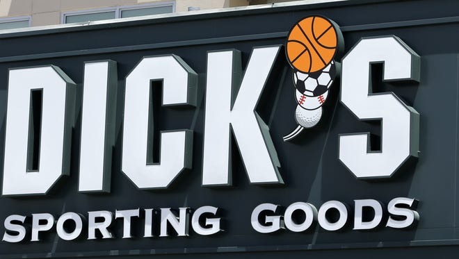 This photo taken Tuesday, Aug. 29, 2017, shows a Dick's Sporting Goods sign at a store in Miami. Dick's Sporting Goods announced Wednesday, Feb. 28, 2018, that it will immediately end sales of assault-style rifles and high capacity magazines at all of its stores and ban the sale of all guns to anyone under 21 years old. The announcement comes two weeks after the school massacre in Parkland, Fla. (AP Photo/Alan Diaz)