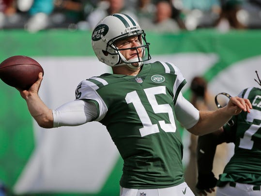 FILE - In this Oct. 15, 2017, file photo, New York Jets quarterback Josh McCown (15) throws a pbad during the first half of an NFL football game against the New England Patriots in East Rutherford, N.J.  Ryan Fitzpatrick and McCown are survivors, aging quarterbacks who keep getting opportunities to prove their worth to NFL teams. The Jets play the Tampa Bay Buccaneers, for whom Fitzpatrick now plays, this week. (AP Photo/Seth Wenig, File)