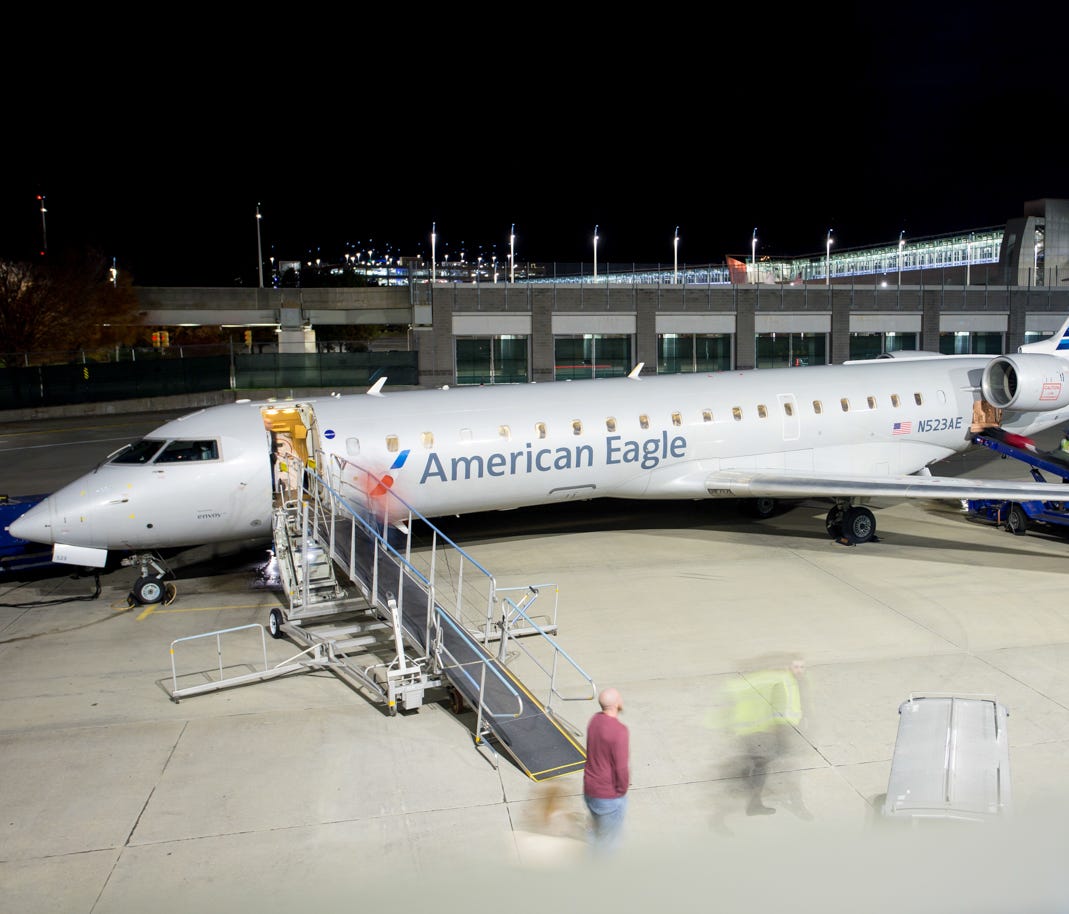 This file photo from 2016 shows fliers exiting an American Eagle Bombardier CRJ-700 at Providence's T.F. Green International Airport in Rhode Island.