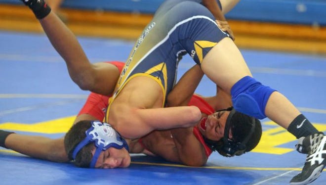 Alex Rabinowitz of Mahopac pinned Quincy Downes of Fox lane in a 120 pound bout during a dual wrestling meet at Mahopac High School Dec. 17, 2015.