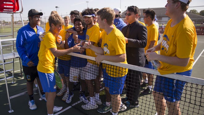 Carmel High School players celebrate their IHSAA boys team tennis state finals victory, North Central High School, Indianapolis, Saturday, Oct. 14, 2017. Carmel High School beat Jasper High School 5 matches to 0 to take their second title in a row.