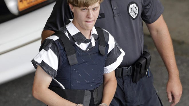 Shooting suspect Dylann Storm Roof is escorted from the Cleveland County Courthouse in Shelby, N.C., in June 2015. Roof was convicted Thursday of murdering nine African-Americans at a Charleston Church.