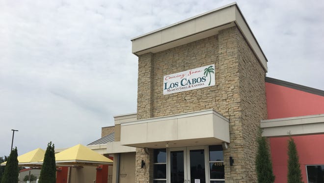 A sign on the former Cantina Laredo announces the building on South National will become Los Cabos Mexican Grill and Cantina.