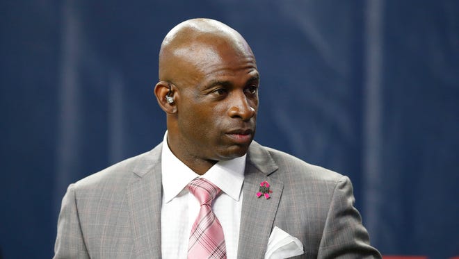 NFL reporter Deion Sanders on the sidelines during a game with the Indianapolis Colts playing against the Houston Texans at NRG Stadium in October of 2015.