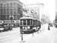 A streetcar makes a stop on Main Street at the corner