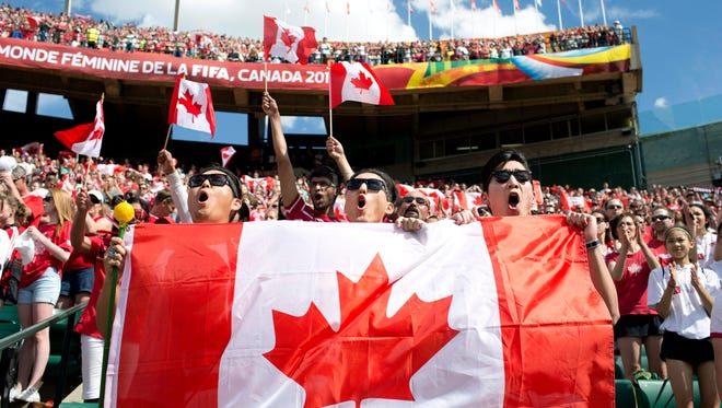 Fans cheer for Team Canada as they take on Team China during a FIFA Women's World Cup soccer match in Edmonton, Alberta, on Saturday June 6, 2015.