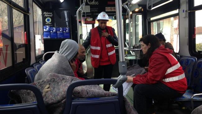 Residents take shelter in a bus.
