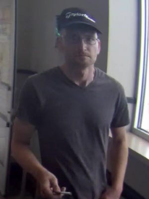 Police are seeking this man, who they say stole 12 cases of Red Bull from the Menomonee Falls Metro Market.