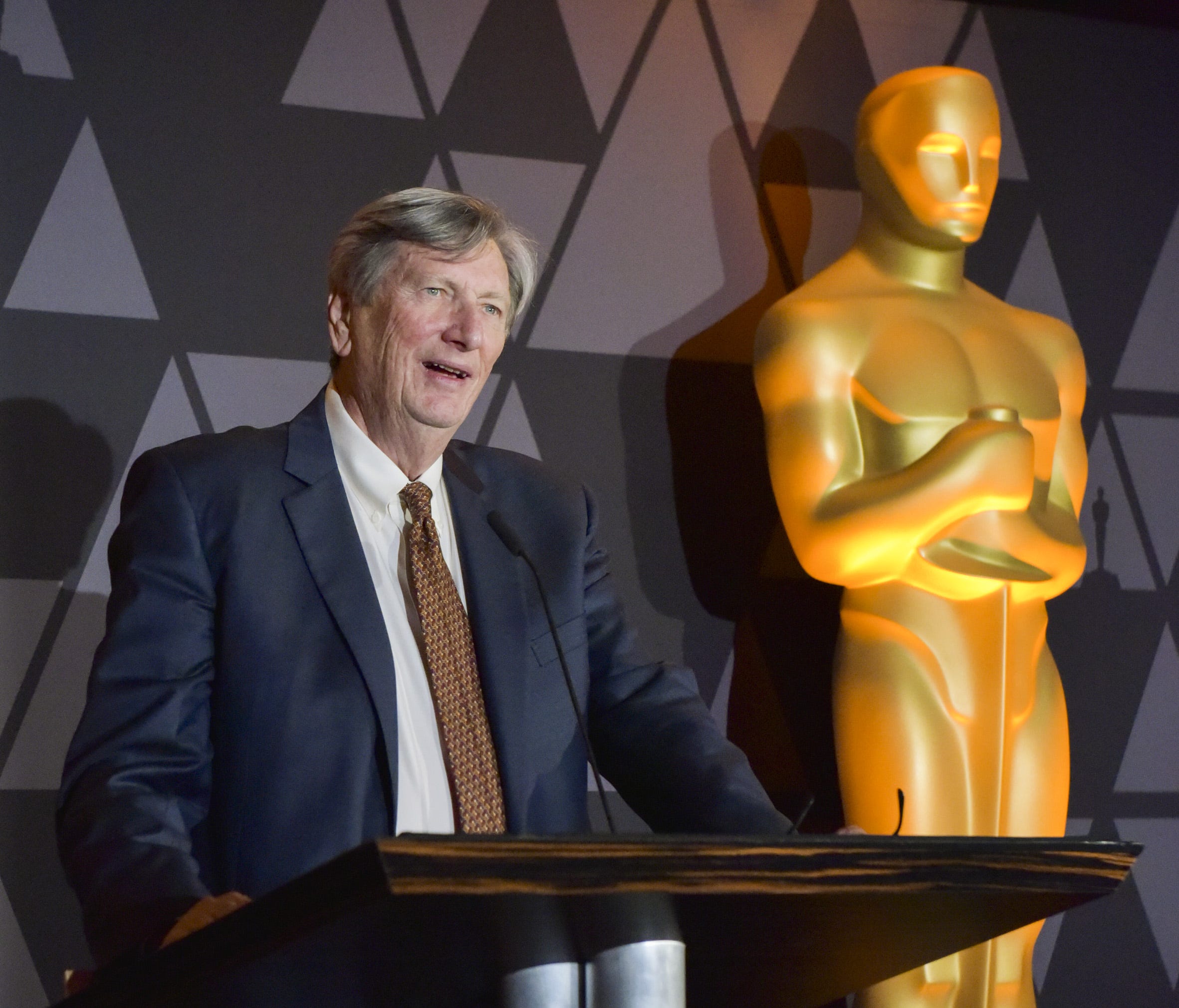 Academy president John Bailey speaks onstage at a reception on March 2.