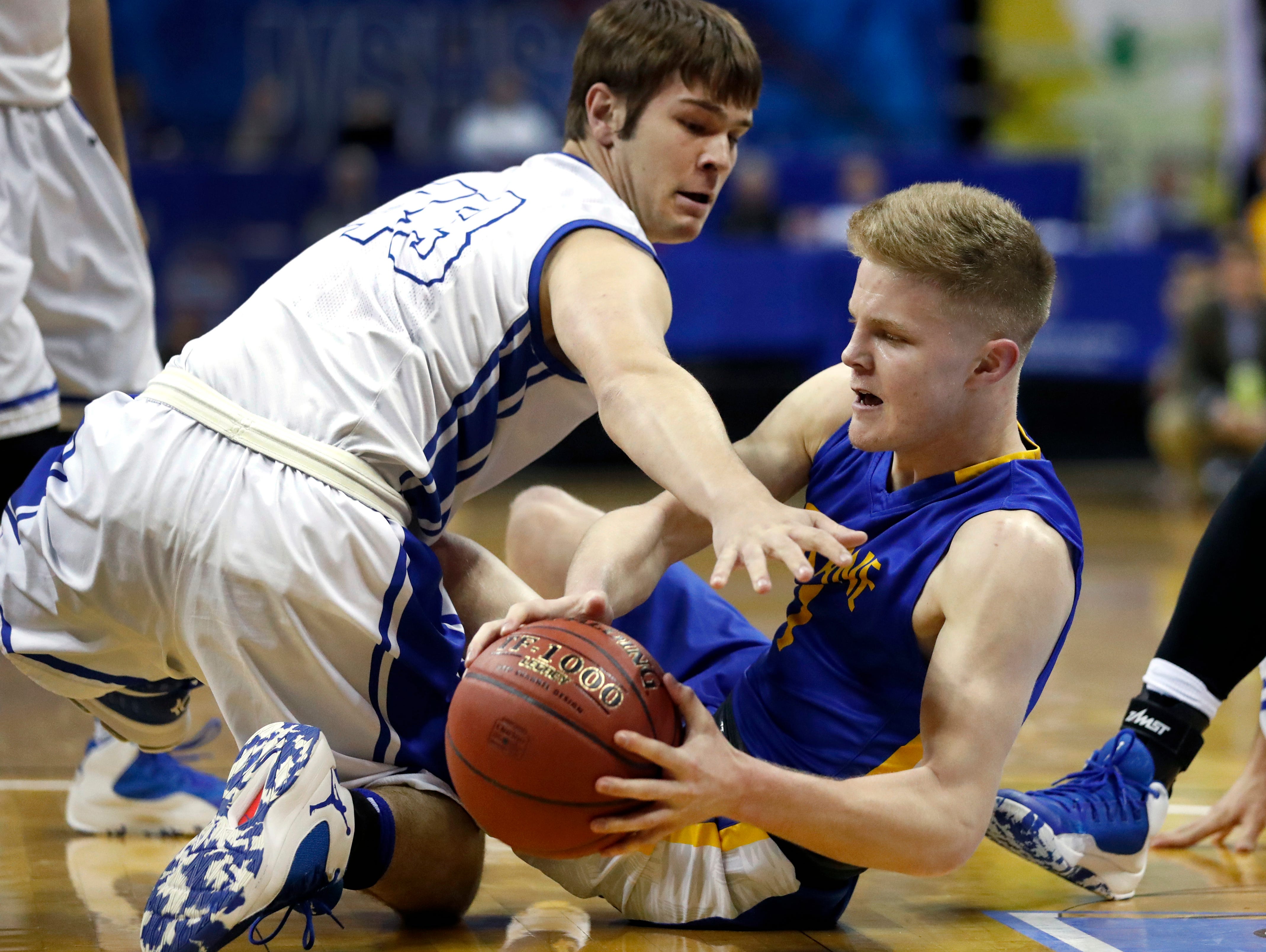 Crane's Dalton Hayes, right, and Oran's Drew Reischman scramble for a loose ball during the first half of the Missouri Class 2 boys high school championship basketball game Saturday, March 11, 2017, in Columbia, Mo.