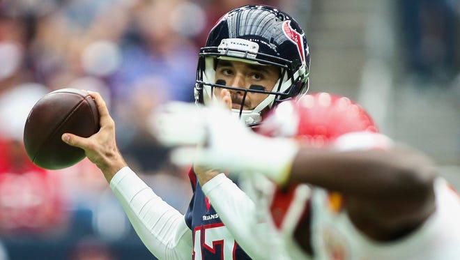 Houston Texans quarterback Brock Osweiler attempts a pass during the first quarter against the Kansas City Chiefs at NRG Stadium on Sunday.
