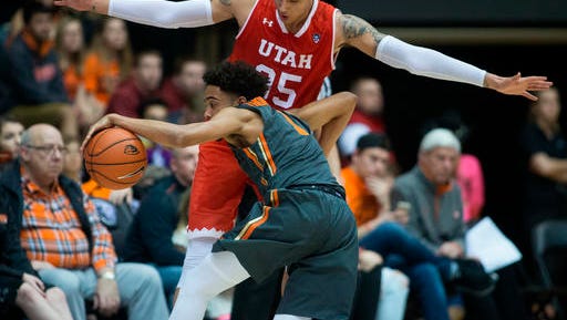 Oregon State's Stephen Thompson Jr. (1) is stopped by Utah's Kyle Kuzma (35) during the second half of an NCAA college basketball game in Corvallis, Ore., Sunday, Feb. 19, 2017. Oregon State won 68-67 for their first win in a Pac-12 Conference game this year. (AP Photo/Timothy J. Gonzalez)