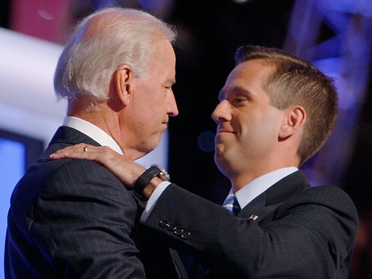 In this Aug. 27, 2008, file photo, Joe Biden embraces