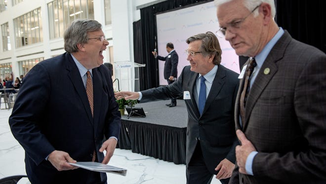 April 18, 2018 - Memphis Mayor Jim Strickland, front from left, Greater Memphis Chamber President Phil Trenary, and Shelby County Mayor Mark Luttrell talk as ServiceMaster CEO Nik Varty takes the stage during an event marking the opening of the new ServiceMaster headquarters in downtown Memphis. (Brandon Dill/Special to The Commercial Appeal)