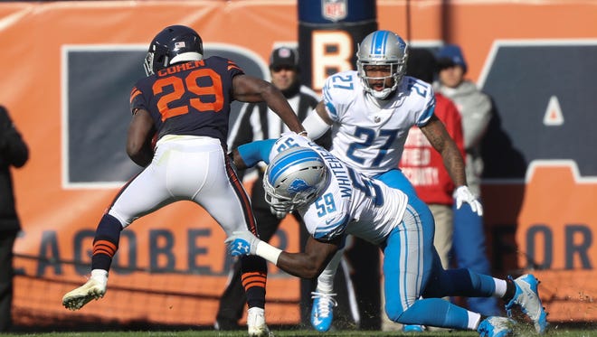Tahir Whitehead tackles the Chicago Bears' Tarik Cohen in the first quarter of the Detroit Lions' 27-24 win Sunday, Nov. 19, 2017 at Soldier Field in Chicago.