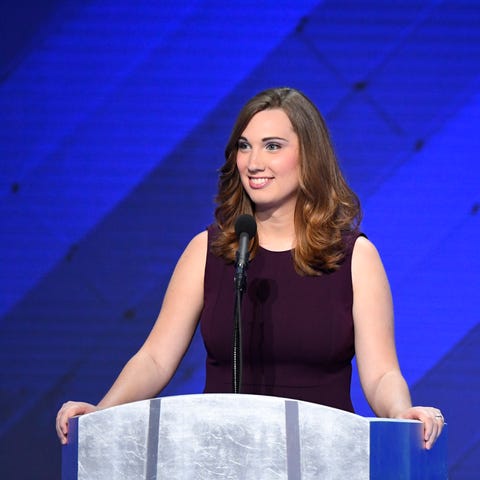 LGBT rights activist Sarah McBride speaks next to 