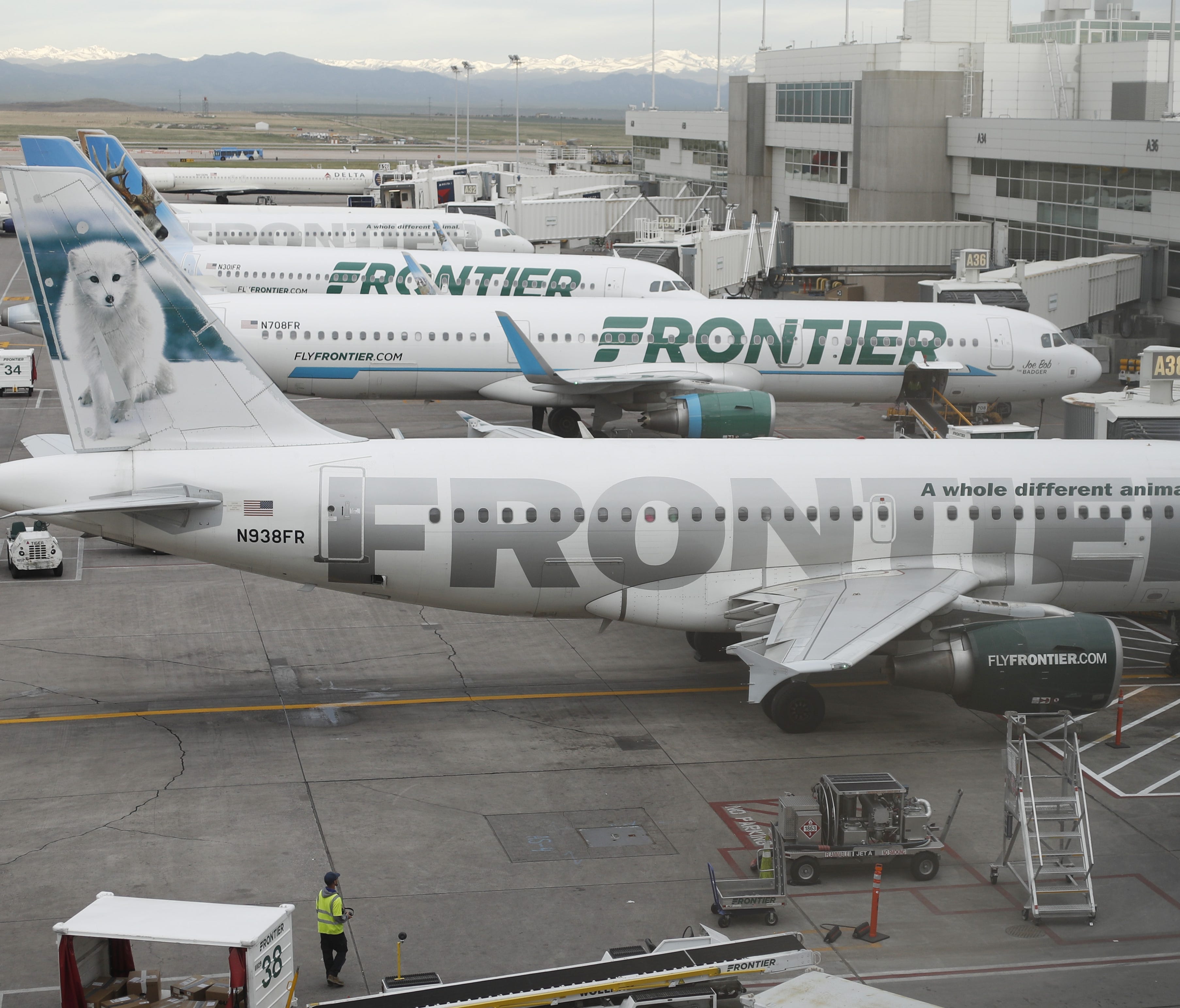 This file photo from May 15, 2017, shows Frontier Airlines jets at Denver International Airport.