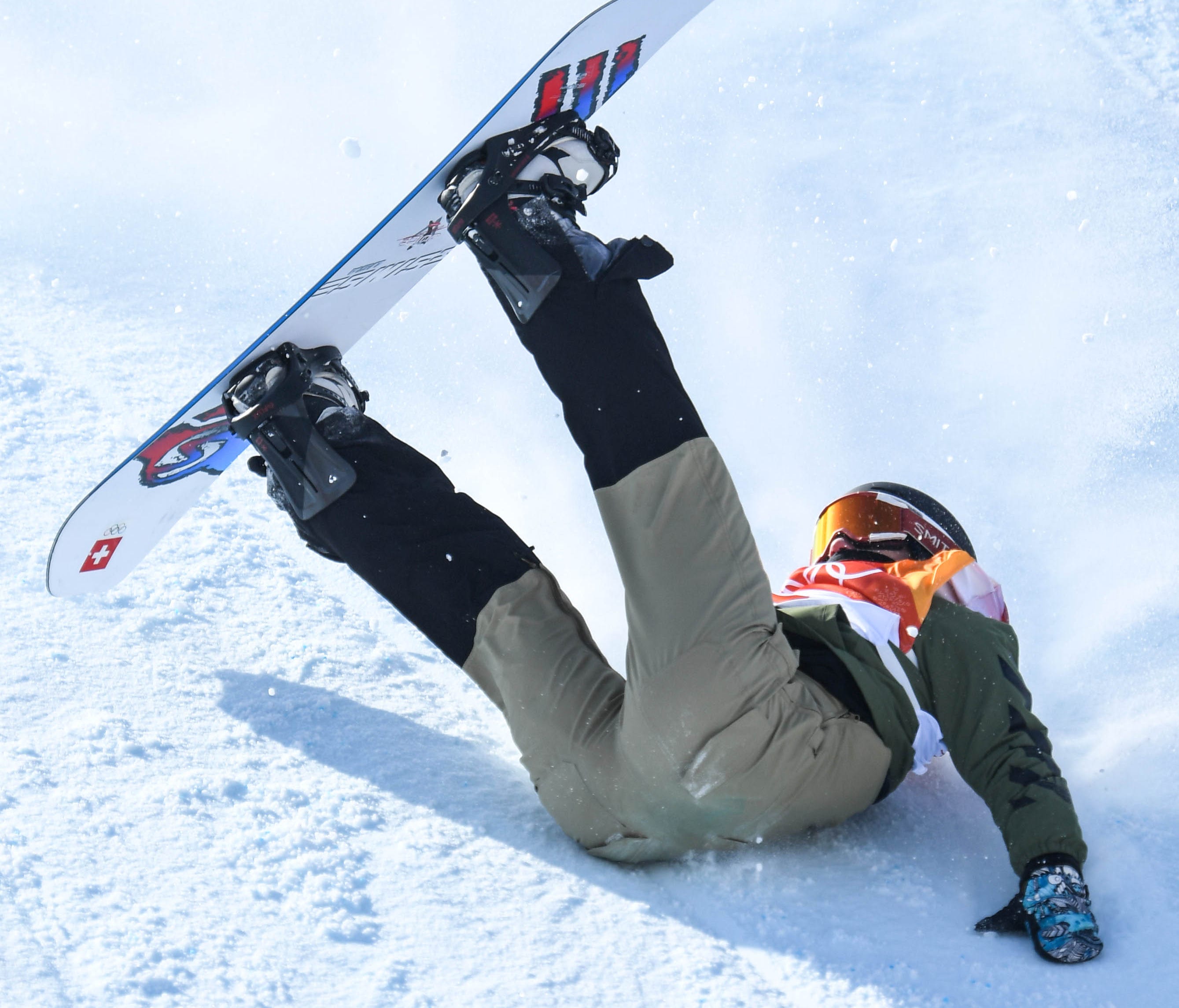 Carla Somaini of Switzerland crashes during her first run in the snowboard slopestyle competition.
