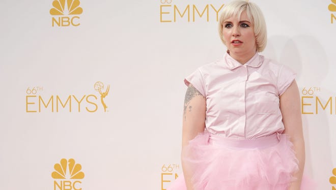 Lena Dunham arrives at the 66th Annual Primetime Emmy Awards at the Nokia Theatre L.A. Live on Monday, Aug. 25, 2014, in Los Angeles.